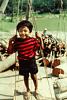  The boy was riding on a balance which is used in weighing firewoods .