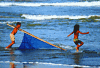  Life of the people near the seashore in Cox\s Bazar is comparetivly hard. The boy is trying to catch some young shrimps for selling and his sister is also running with him as companion. Bangladesh .